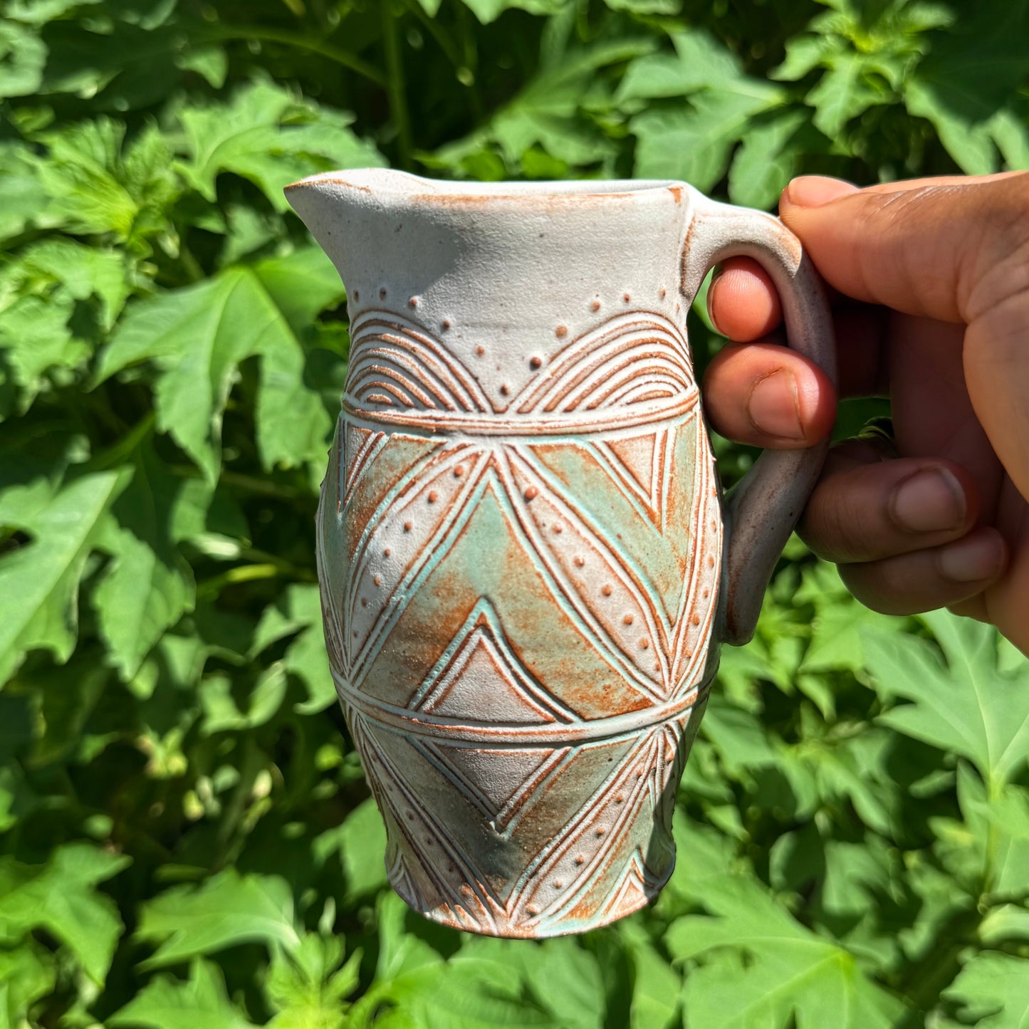 Small Carved Pitcher