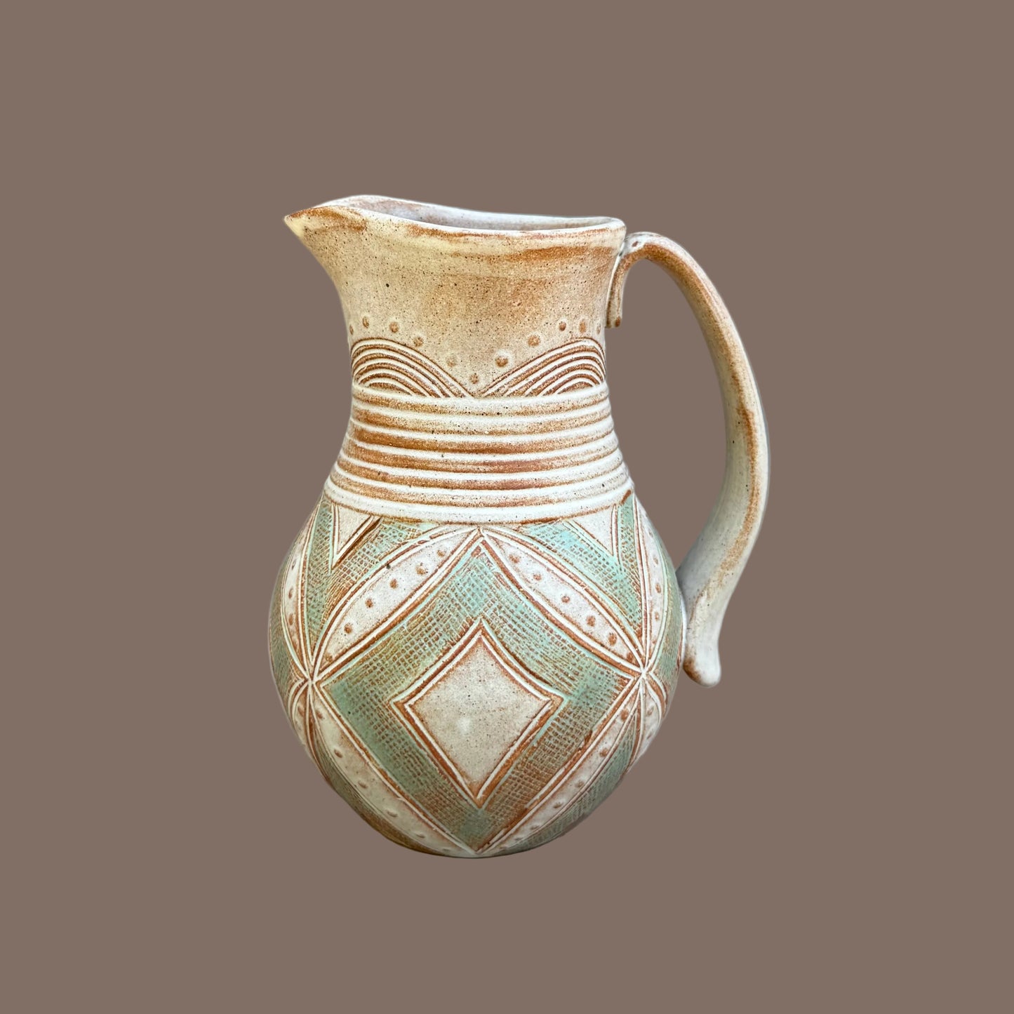 Small Carved Pitcher