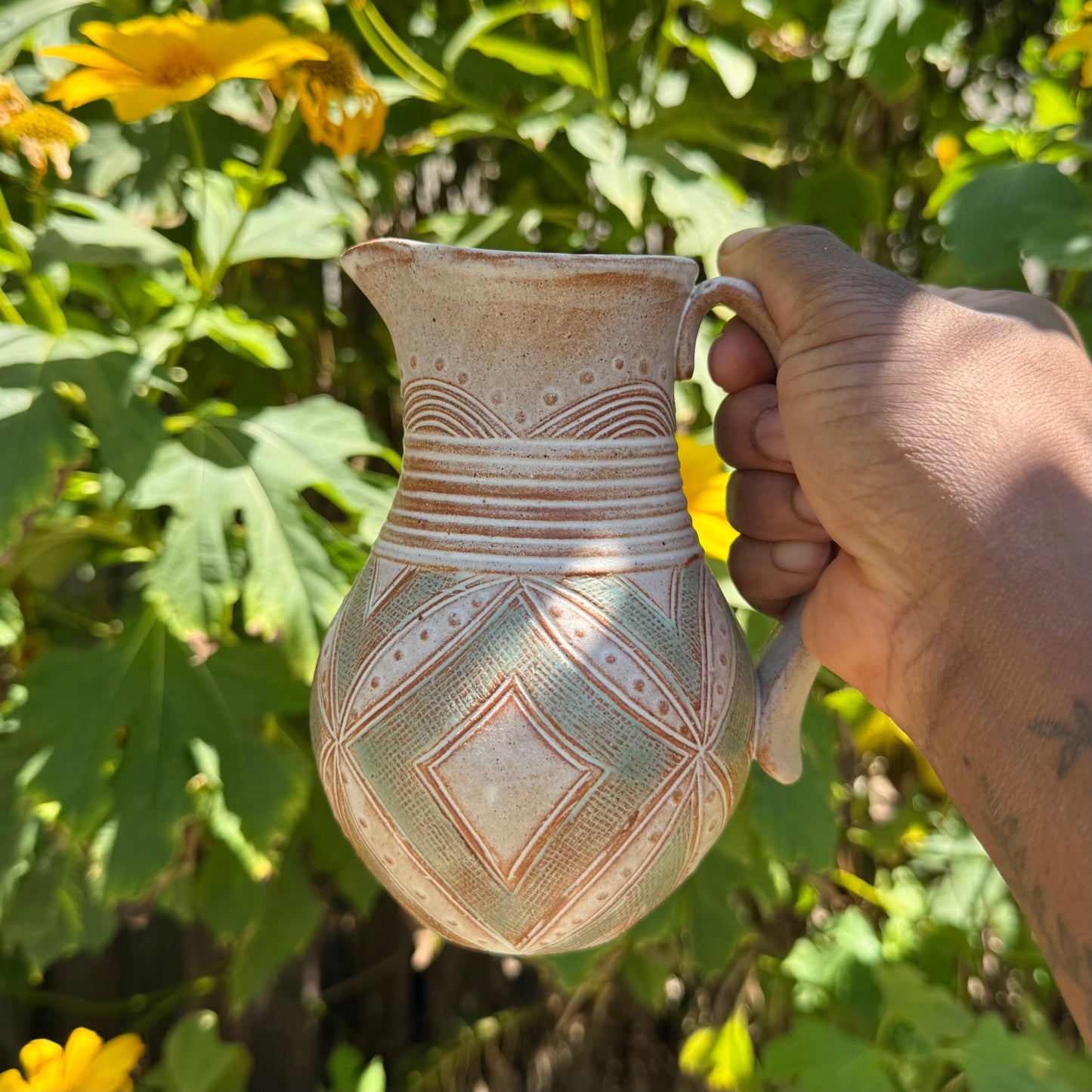 Small Carved Pitcher