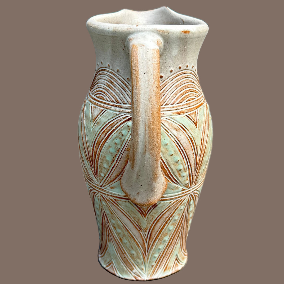 Carved Pitcher